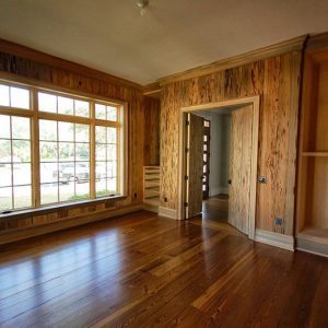 Antique Heart Pine Floors and River Recovered Cypress + Pecky Walls