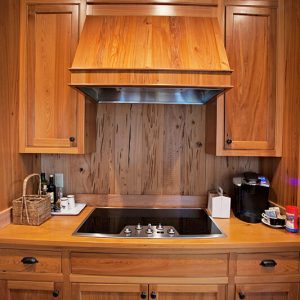 River Recovered Cypress Cabinets and Pecky Backsplash